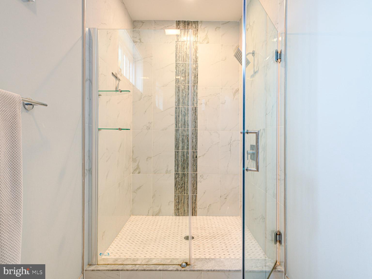 2639 Jasper Street Philadelphia, PA 19125 - Photo 20 of 23 a bathroom with a glass shower door