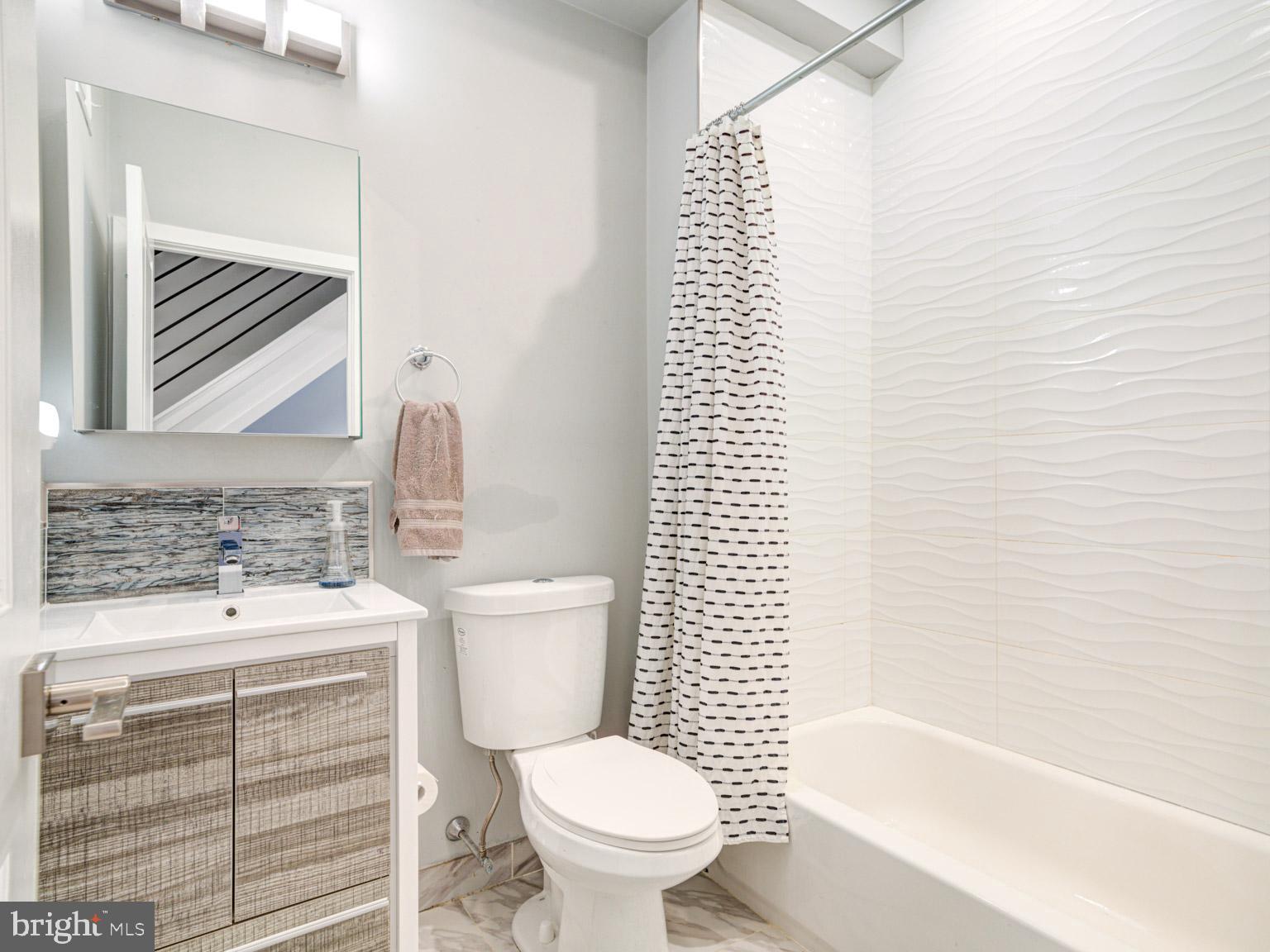 2639 Jasper Street Philadelphia, PA 19125 - Photo 21 of 23 a bathroom with a toilet a sink and a bathtub