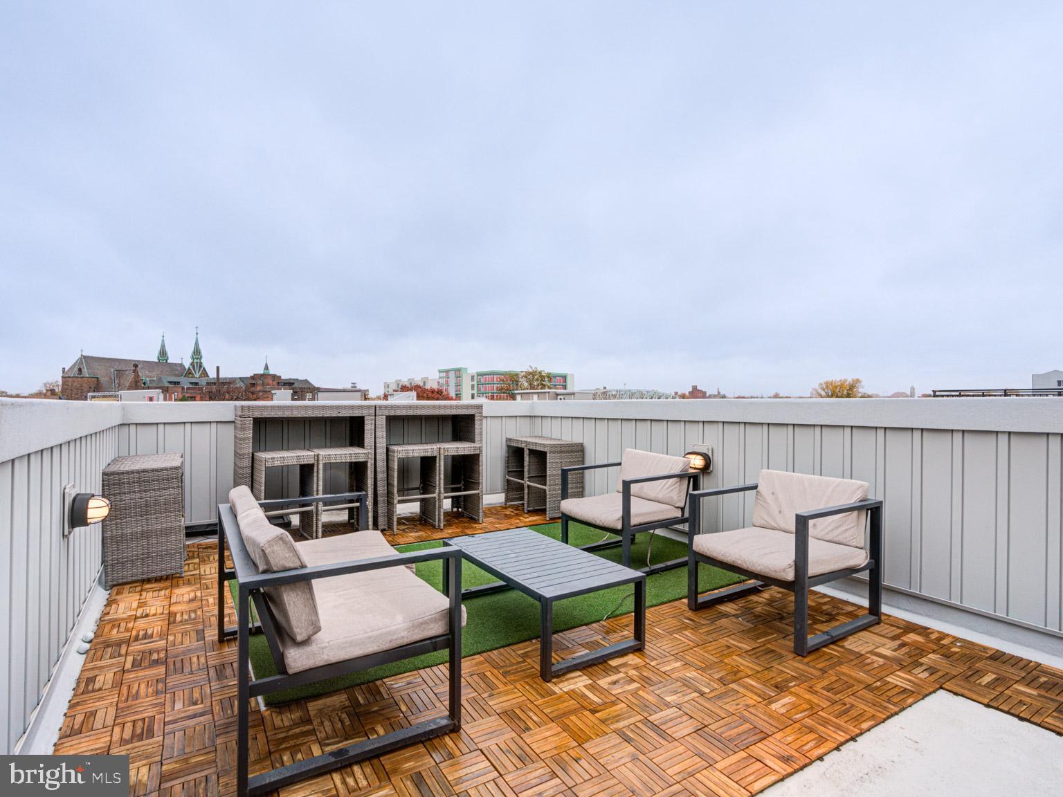 2639 Jasper Street Philadelphia, PA 19125 - Photo 7 of 23 a roof deck with a table and chairs