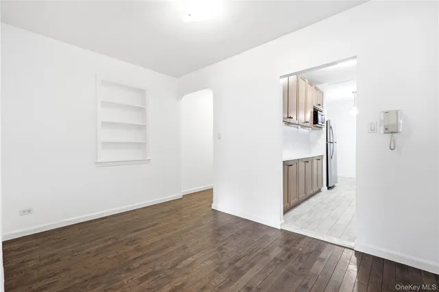 a view of a kitchen with wooden floor