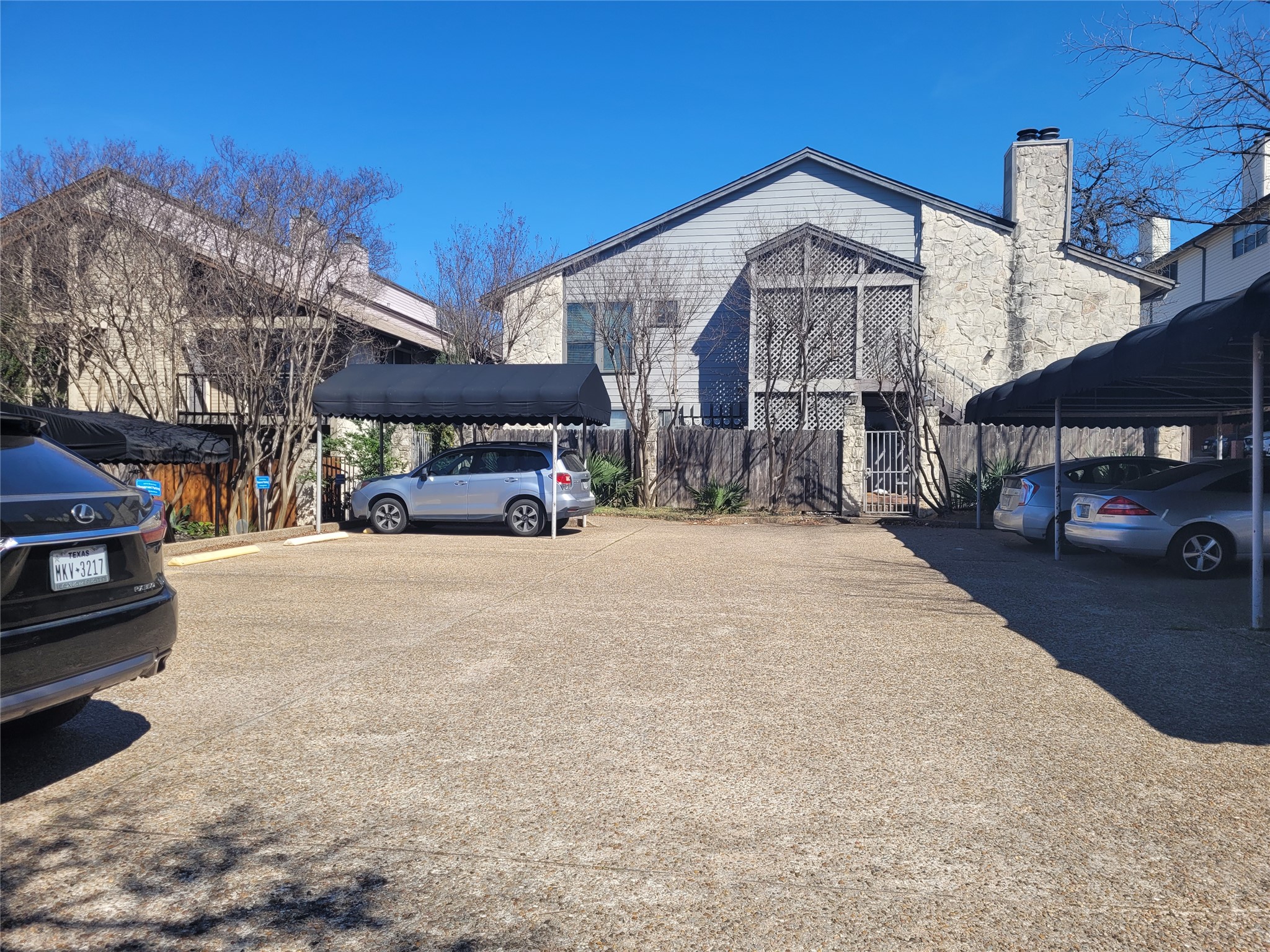 2410 Enfield Road, Unit 7 Austin, TX 78703 - Photo 11 of 19 a front view of a building with parking
