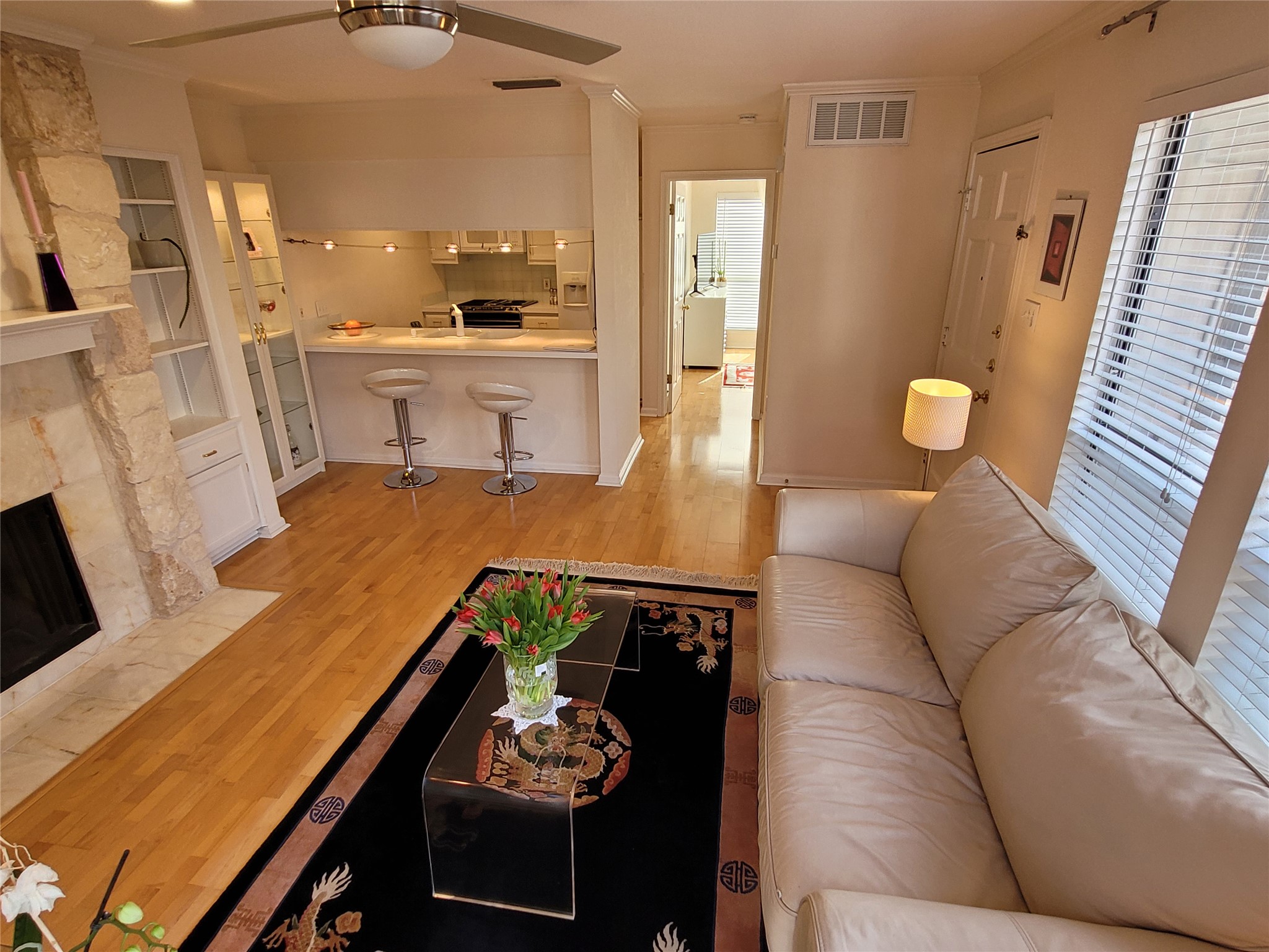 2410 Enfield Road, Unit 7 Austin, TX 78703 - Photo 14 of 19 a living room with furniture and wooden floor