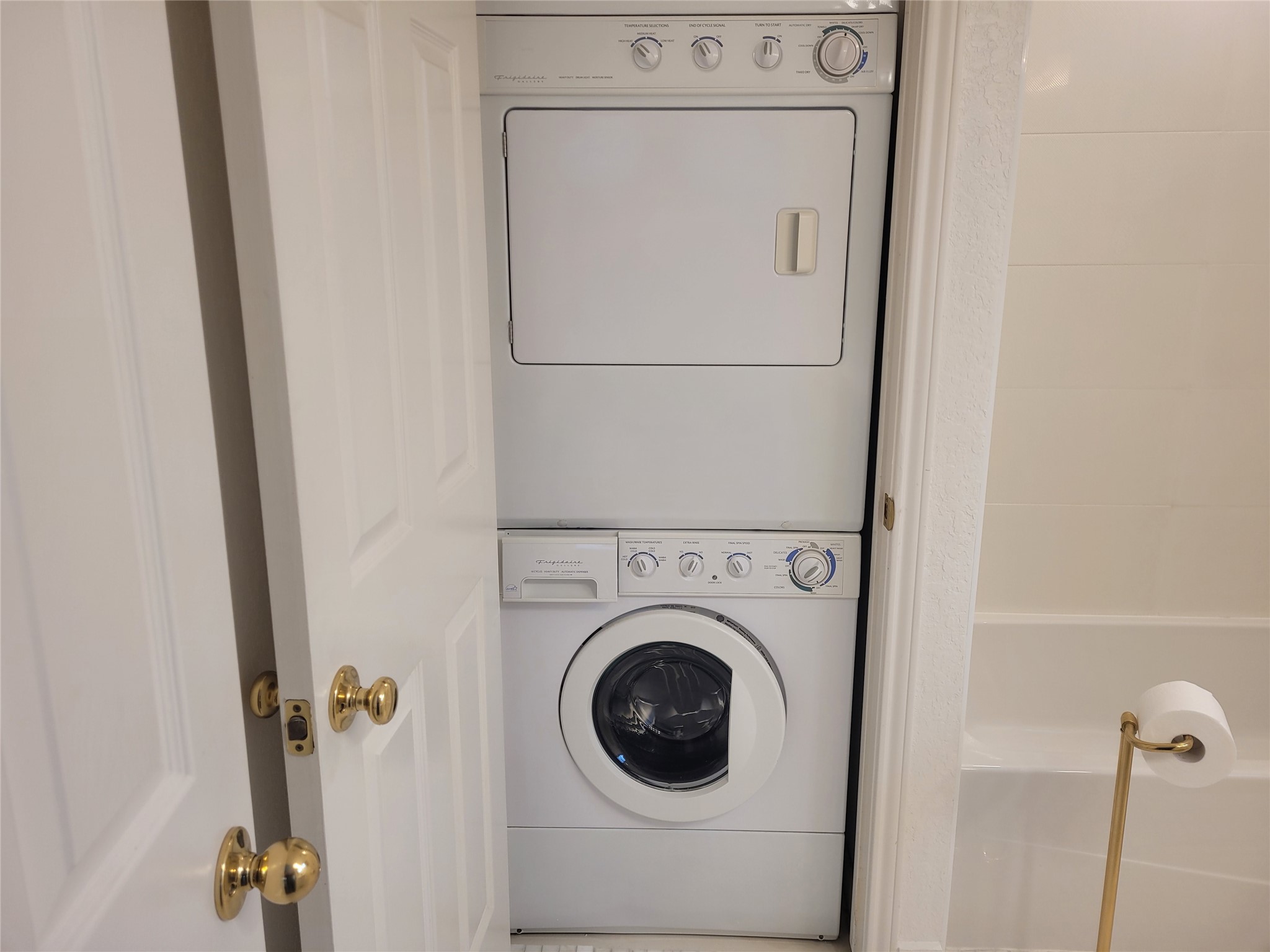 2410 Enfield Road, Unit 7 Austin, TX 78703 - Photo 16 of 19 a utility room with dryer and washer