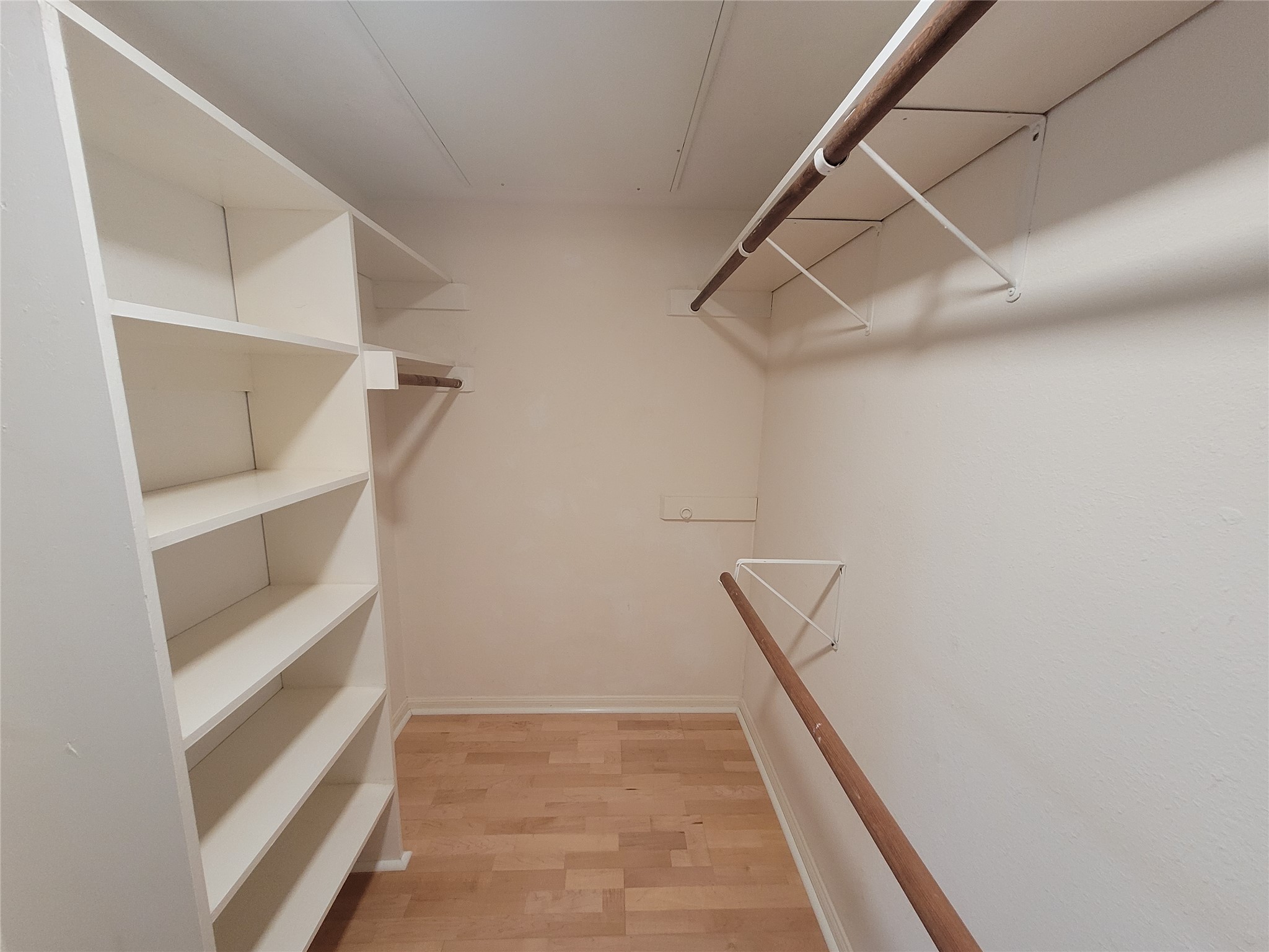 2410 Enfield Road, Unit 7 Austin, TX 78703 - Photo 17 of 19 a view of an empty walk in closet
