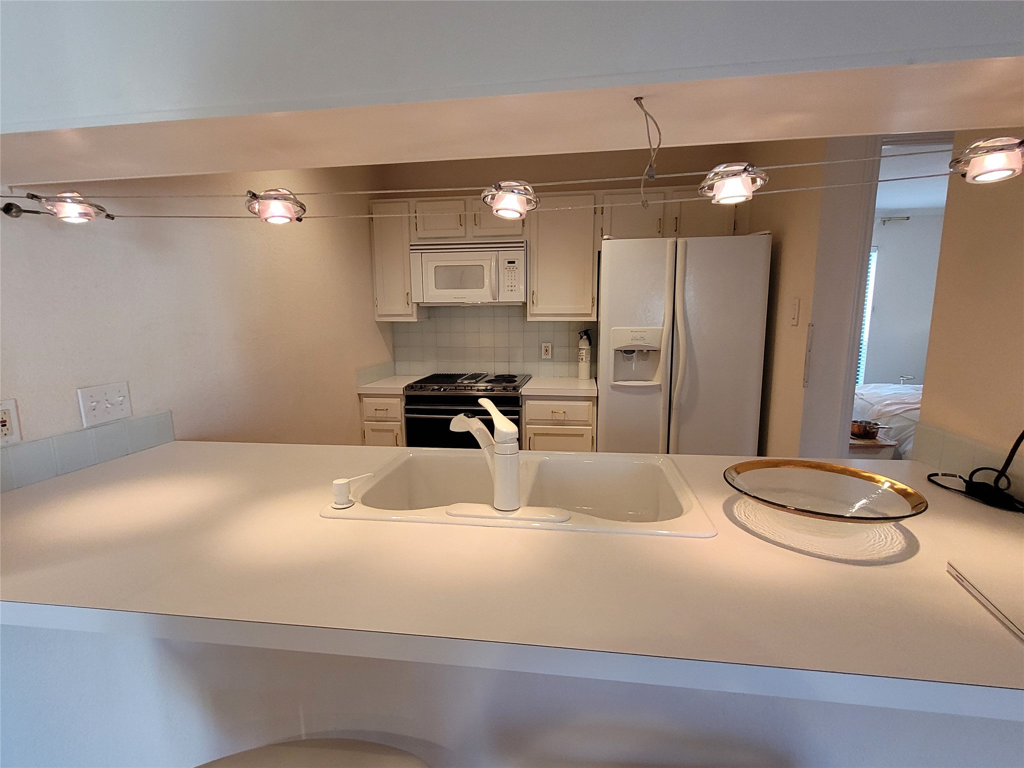 2410 Enfield Road, Unit 7 Austin, TX 78703 - Photo 4 of 19 a bedroom with a bed and a mirror