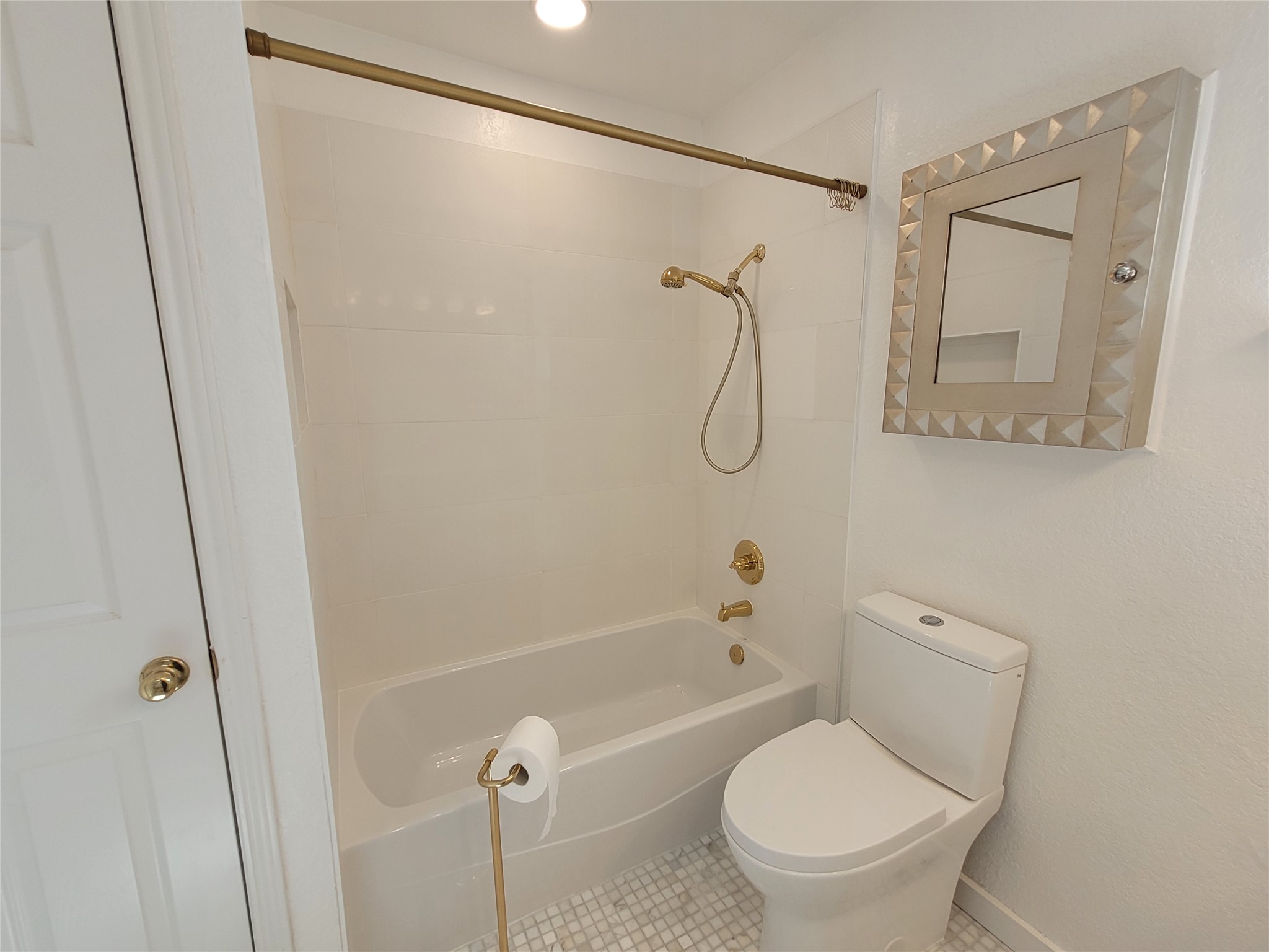 2410 Enfield Road, Unit 7 Austin, TX 78703 - Photo 6 of 19 a bathroom with a toilet and a shower