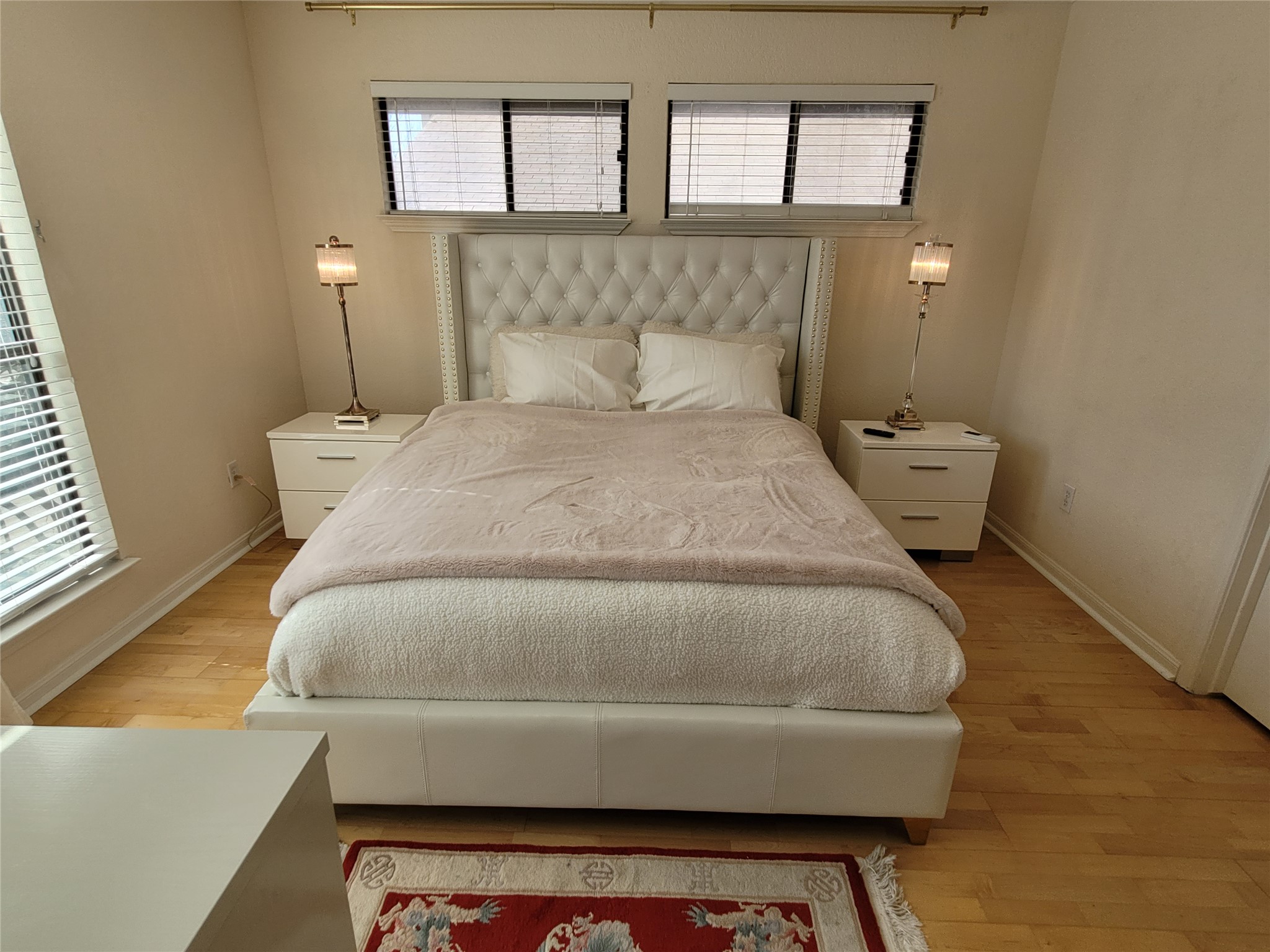 2410 Enfield Road, Unit 7 Austin, TX 78703 - Photo 8 of 19 a bedroom with a bed and window