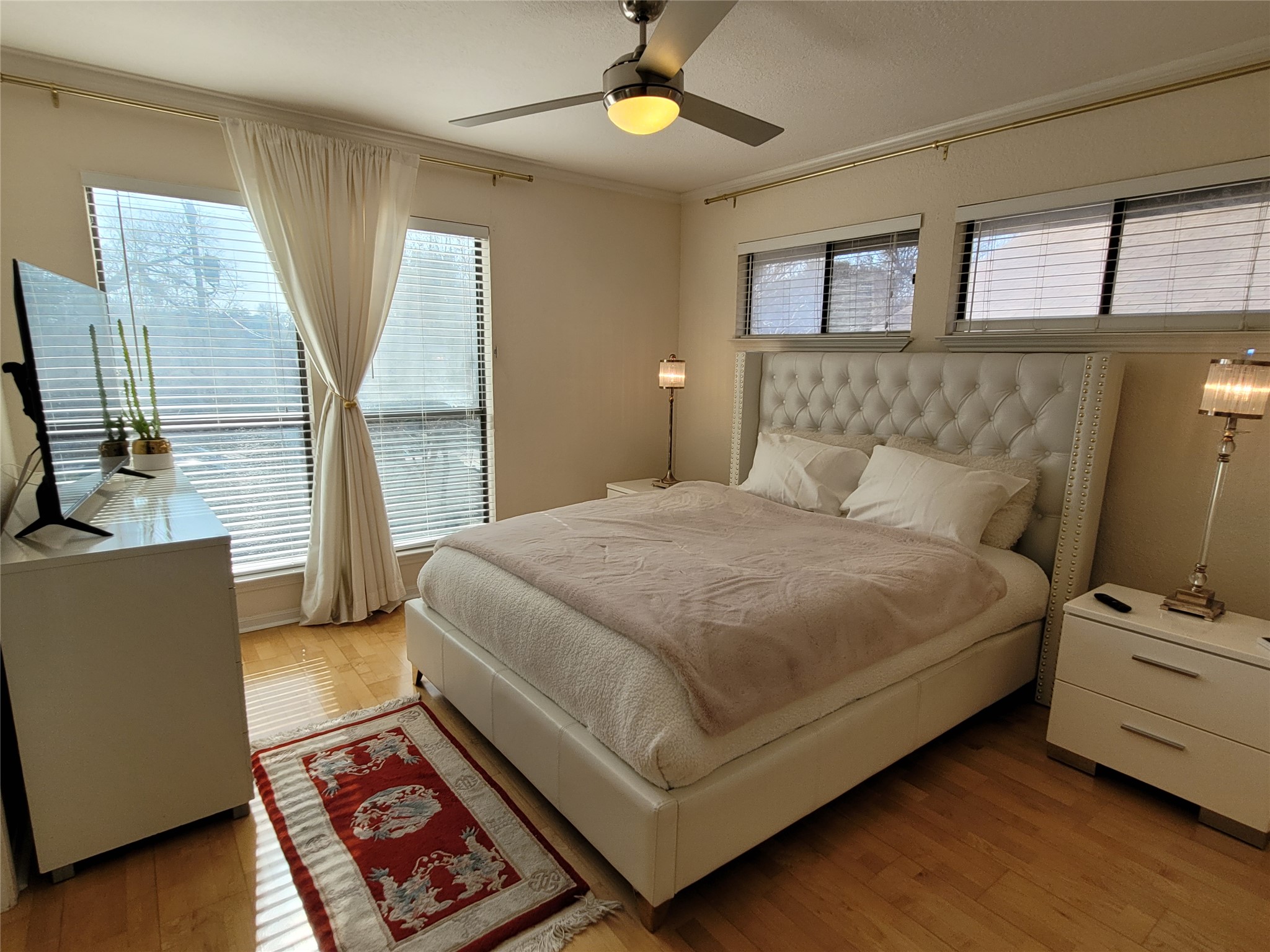 2410 Enfield Road, Unit 7 Austin, TX 78703 - Photo 9 of 19 a bedroom with a bed and window