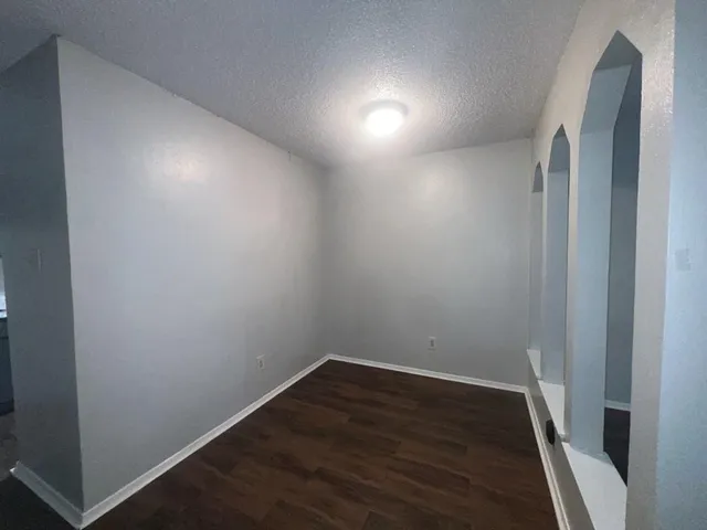 a view of hallway with wooden floor