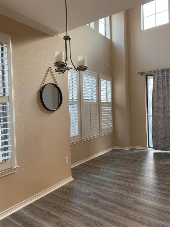2018 Azure Pointe Richardson, TX 75080 - Photo 5 of 8 a view of a livingroom with wooden floor and a window