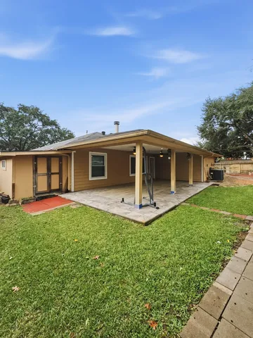 front view of a house with a garden