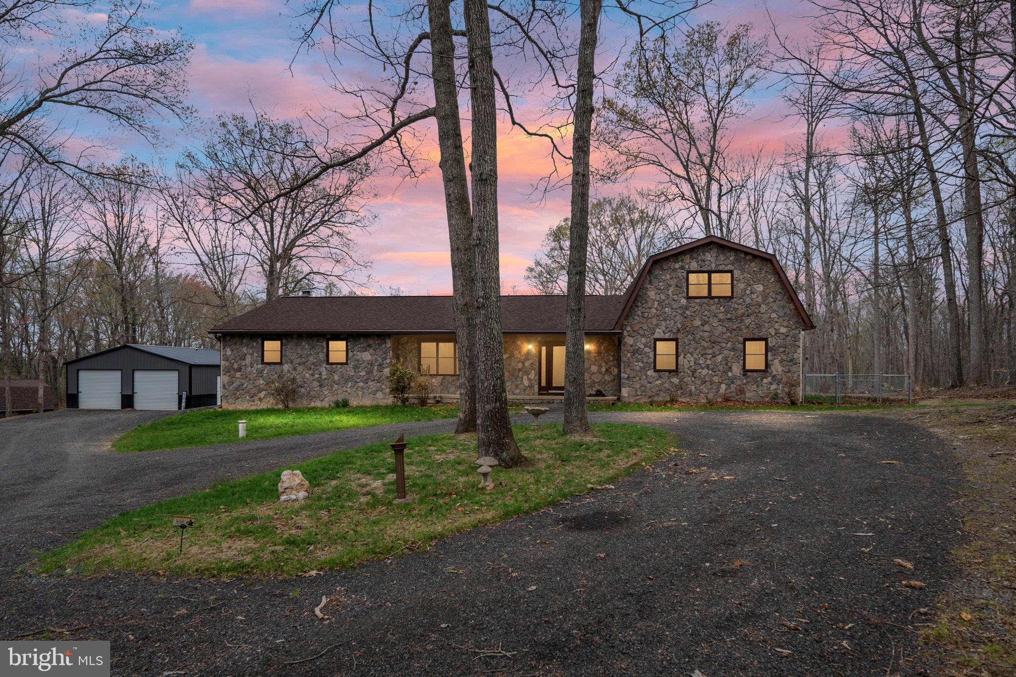 Charming stone home in serene woods.