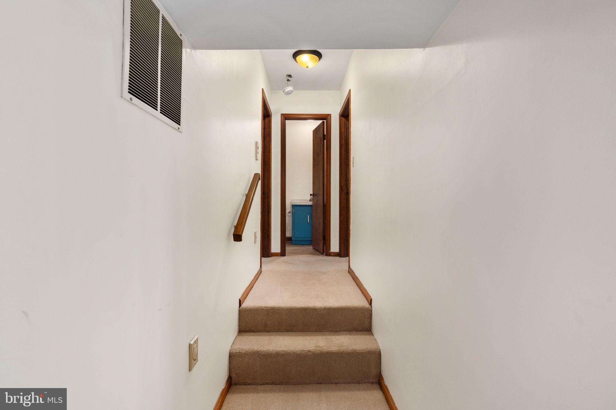 13220 Sillamon Road Goldvein, VA 22720 - Photo 38 of 57 Inviting hallway with warm tones.