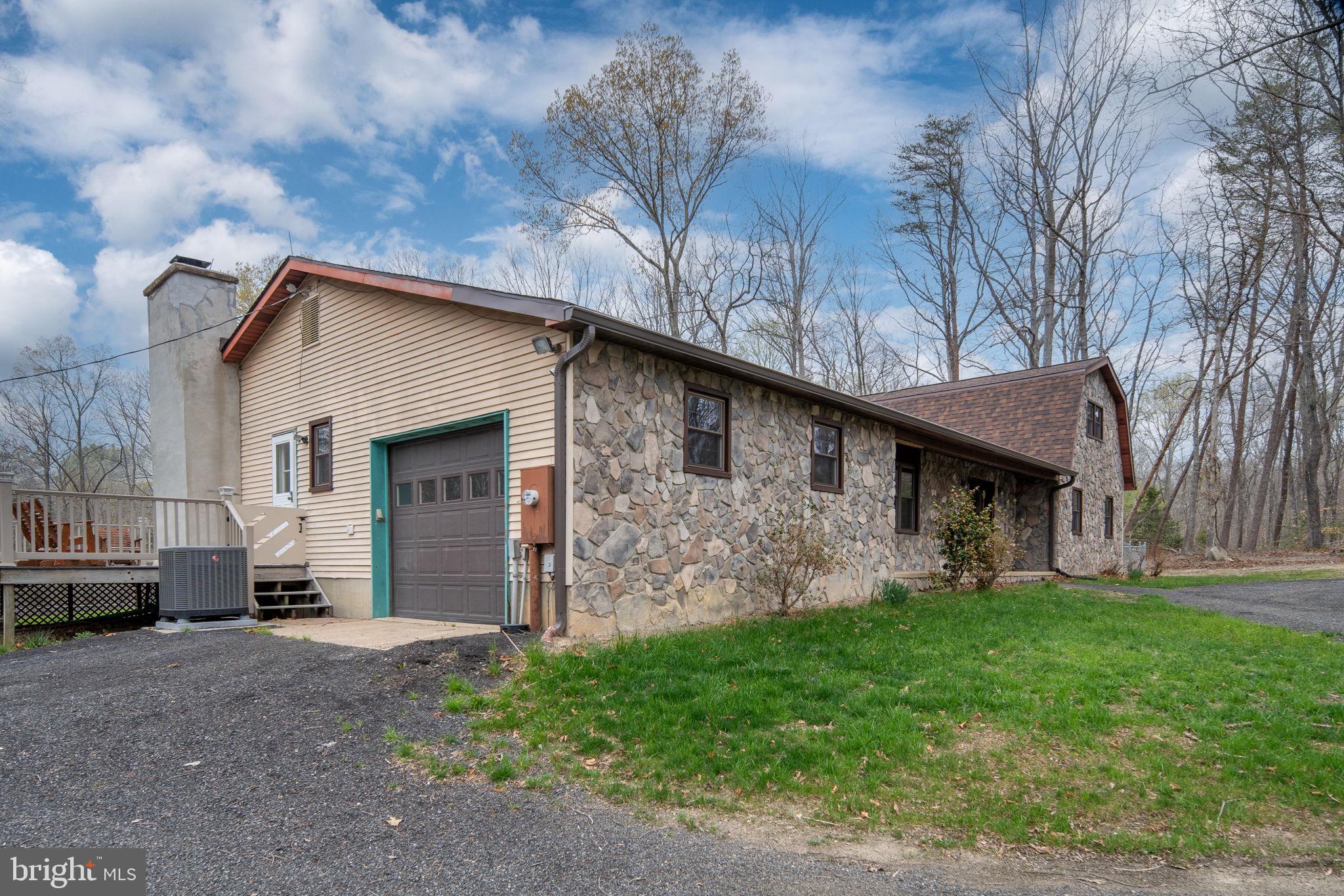 13220 Sillamon Road Goldvein, VA 22720 - Photo 54 of 57 a front view of a house with garden