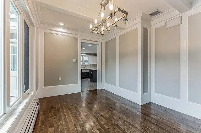 a view of livingroom with hallway with wooden floor