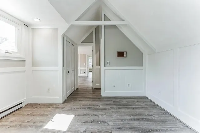 a bathroom with a granite countertop sink mirror and a shower