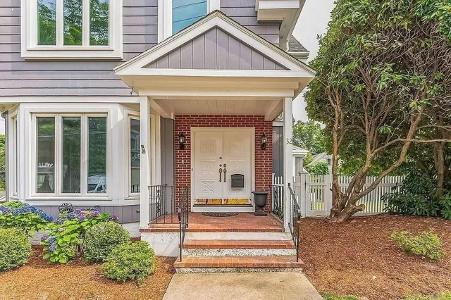 a front view of a house with a porch