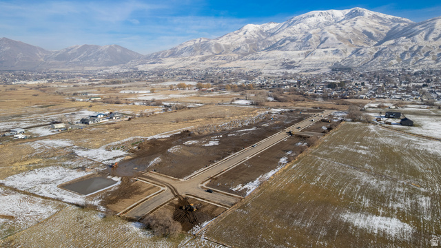 1380 West 2350 South, Unit 16 Perry, UT 84302 - Photo 25 of 25 Snowy aerial view featuring a mountain view and a residential view