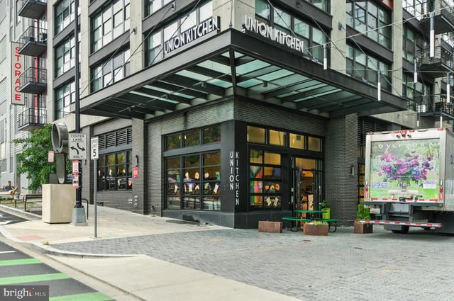 a view of a building with sitting area