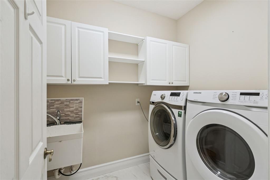 2230 Ridgewind Way Windermere, FL 34786 - Photo 30 of 38 a utility room with dryer and washer