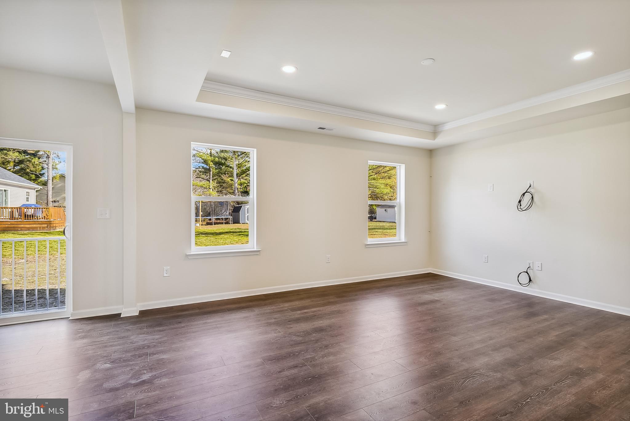 15330 Hildegard Lane Silver Spring, MD 20905 - Photo 15 of 45 an empty room with wooden floor and windows