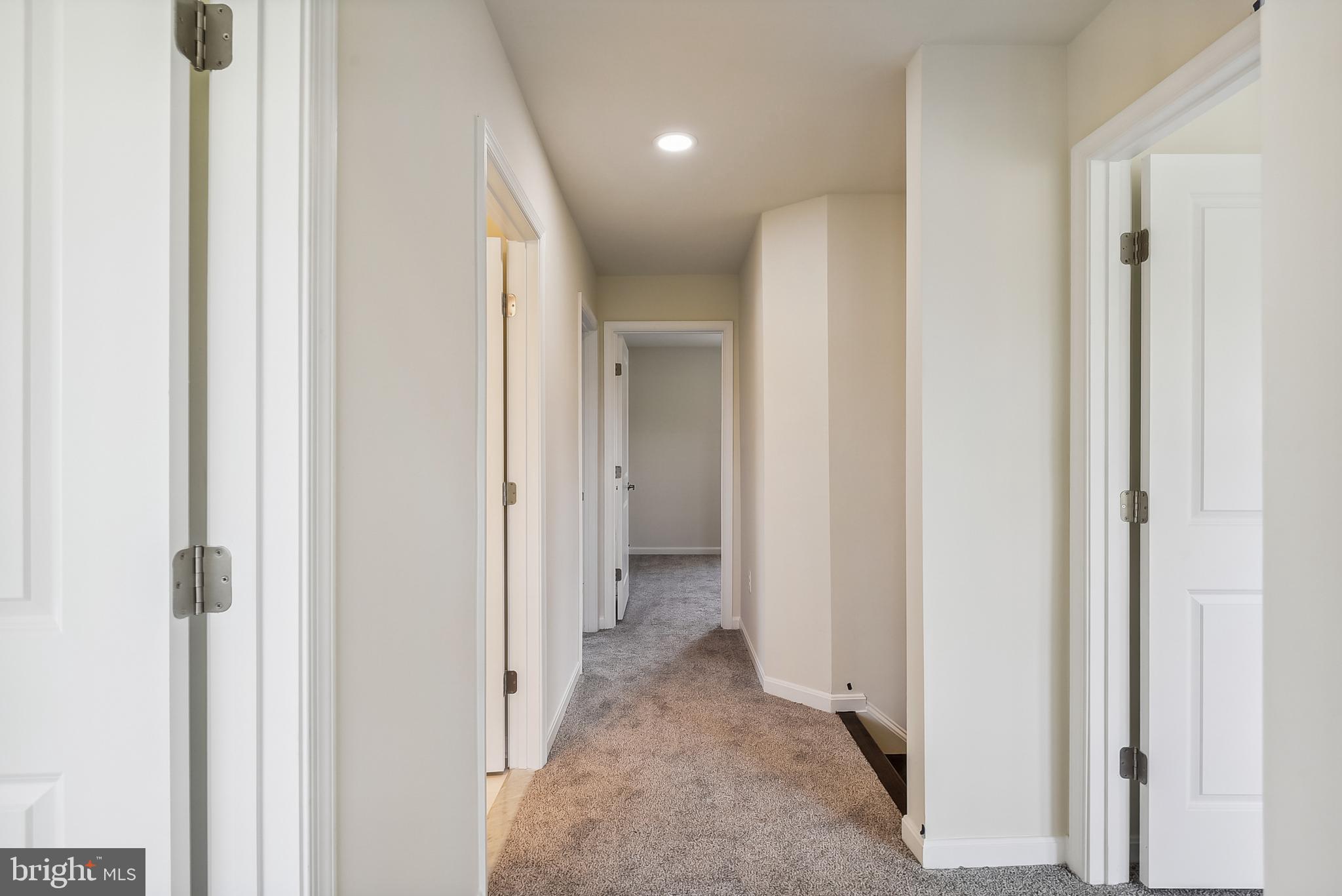 15330 Hildegard Lane Silver Spring, MD 20905 - Photo 27 of 45 a view of a hallway with closet and wooden floor