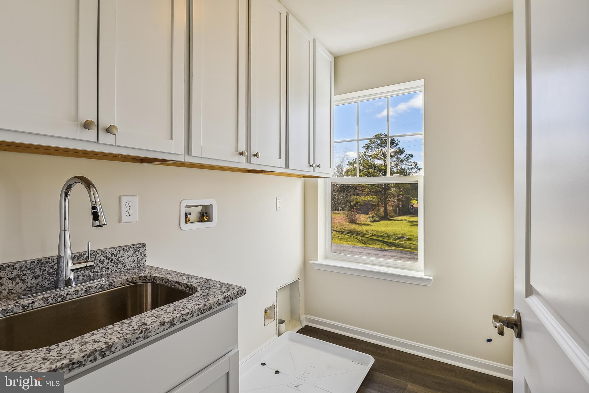 15330 Hildegard Lane Silver Spring, MD 20905 - Photo 32 of 45 a kitchen with a sink and cabinets