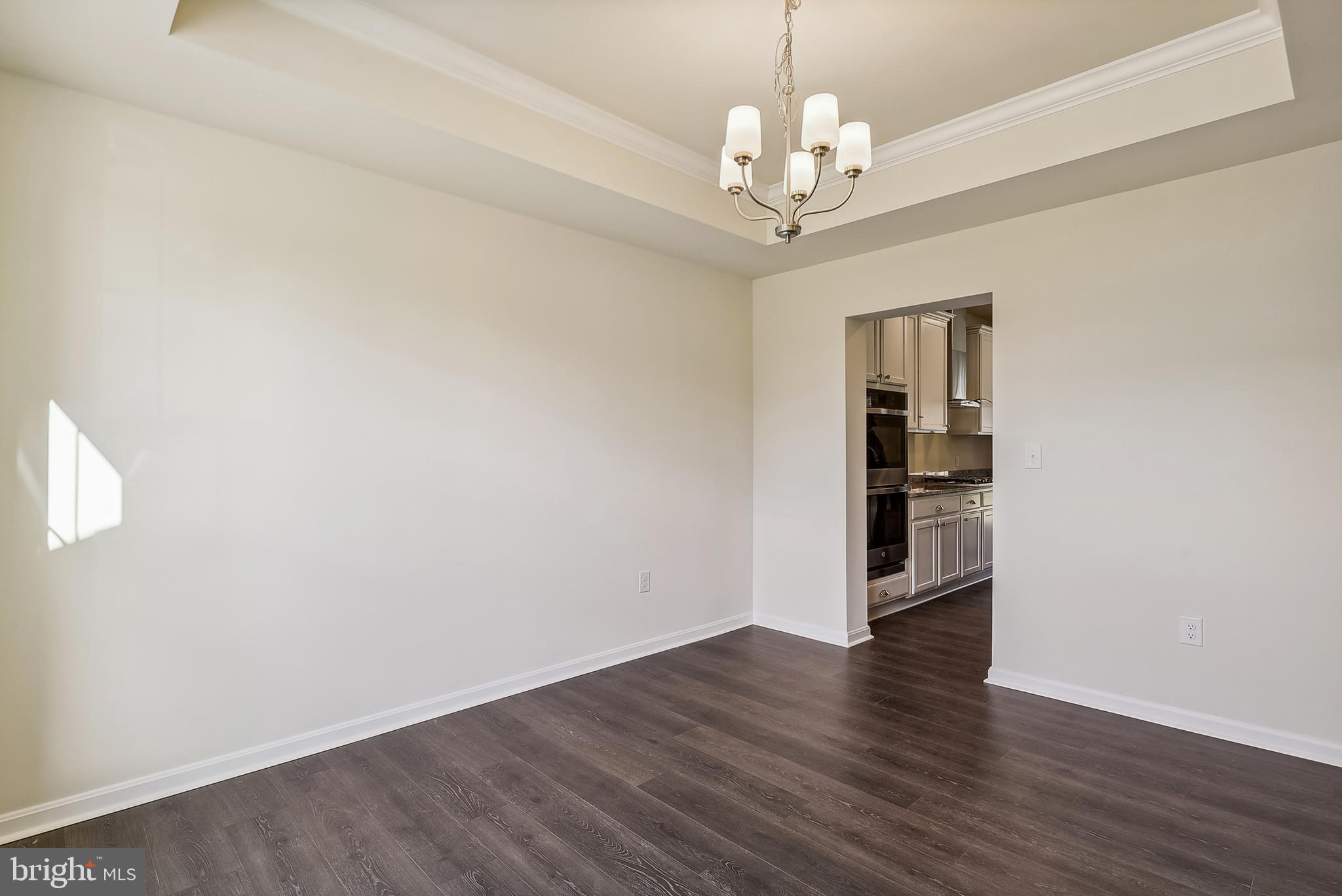 15330 Hildegard Lane Silver Spring, MD 20905 - Photo 10 of 45 a view of a big room with wooden floor and windows