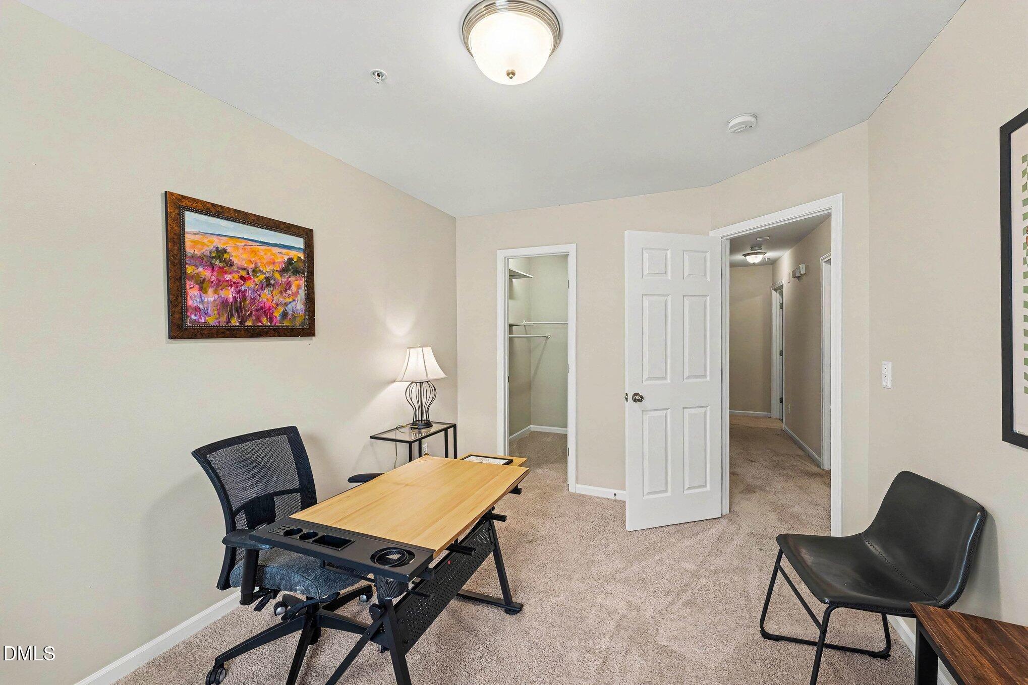 1130 Renewal Place, Unit 106 Raleigh, NC 27603 - Photo 24 of 34 a view of a livingroom with furniture and a chair