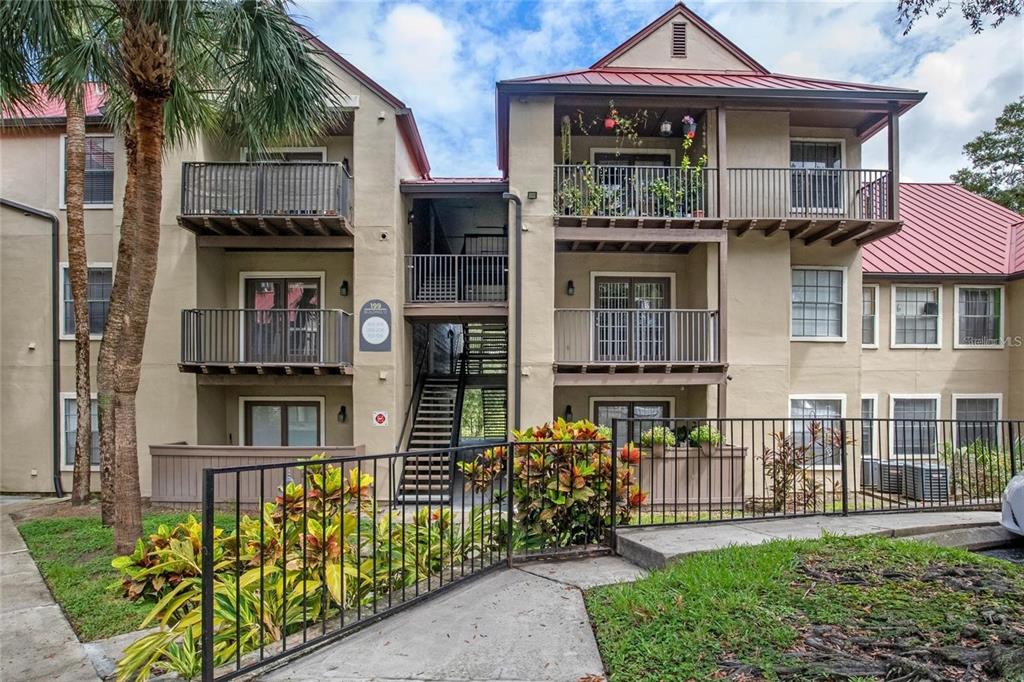 238 Afton Square, Unit 106 Altamonte Springs, FL 32714 - Photo 1 of 1 a front view of a house with a garden