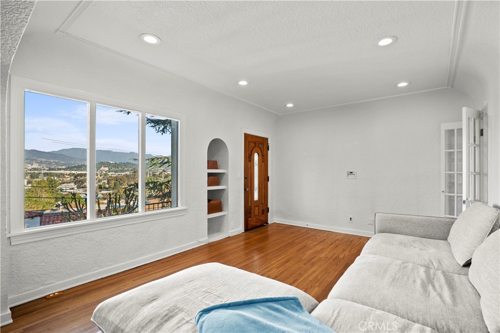 2559 Corralitas Drive Silver Lake, CA 90039 - Photo 11 of 54 a bedroom with a large bed and a large window