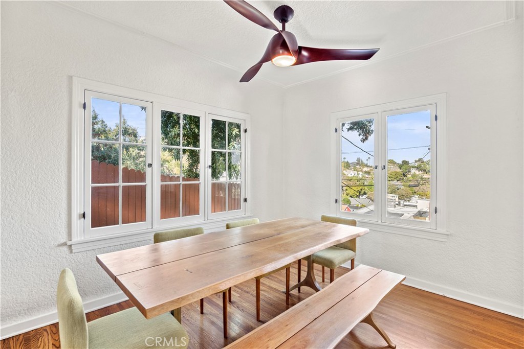 2559 Corralitas Drive Silver Lake, CA 90039 - Photo 13 of 54 a view of a dining room with furniture window and wooden floor