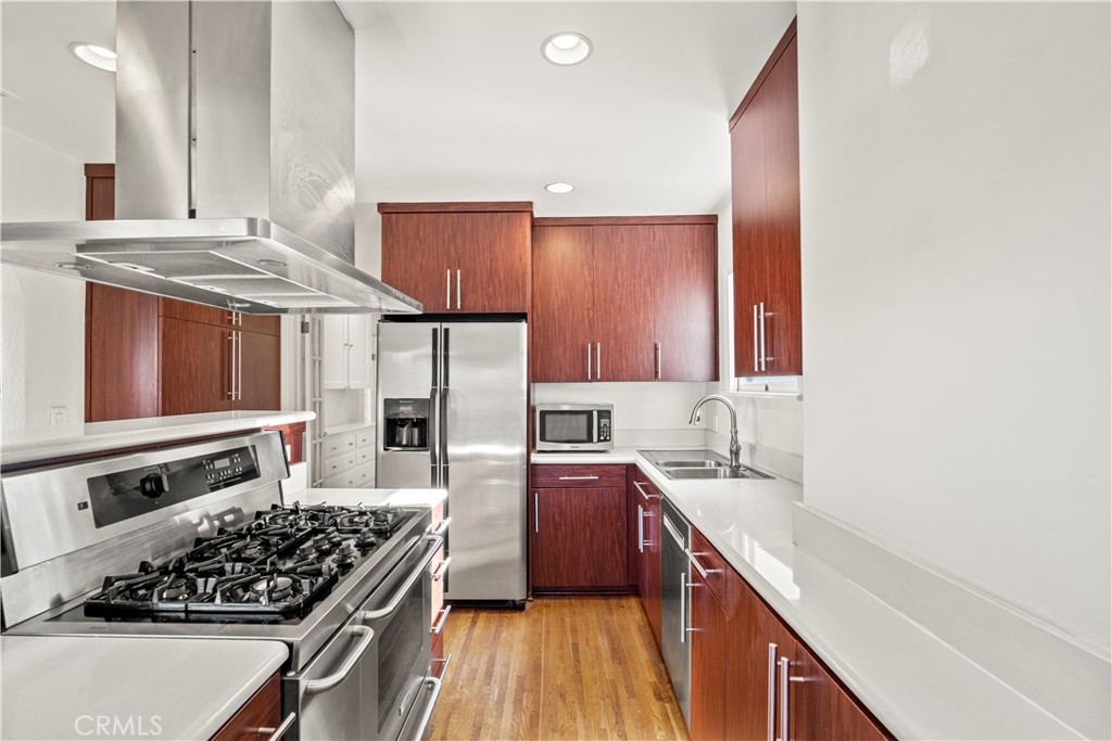 2559 Corralitas Drive Silver Lake, CA 90039 - Photo 20 of 54 a kitchen with stainless steel appliances granite countertop a sink stove and refrigerator