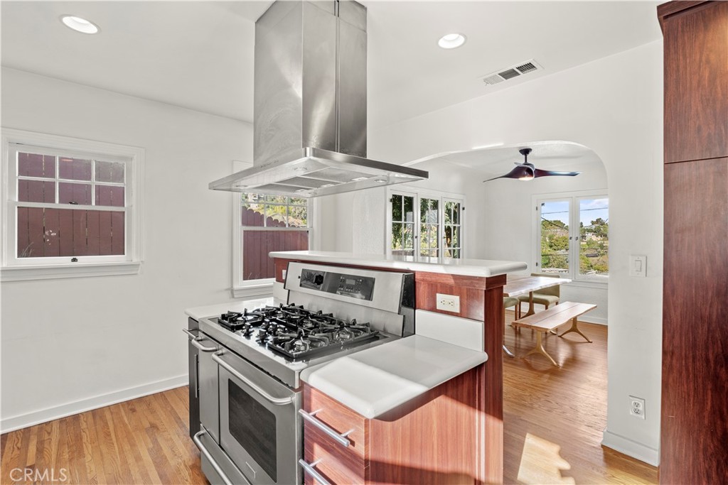 2559 Corralitas Drive Silver Lake, CA 90039 - Photo 21 of 54 a kitchen with stainless steel appliances granite countertop a stove and a wooden floors