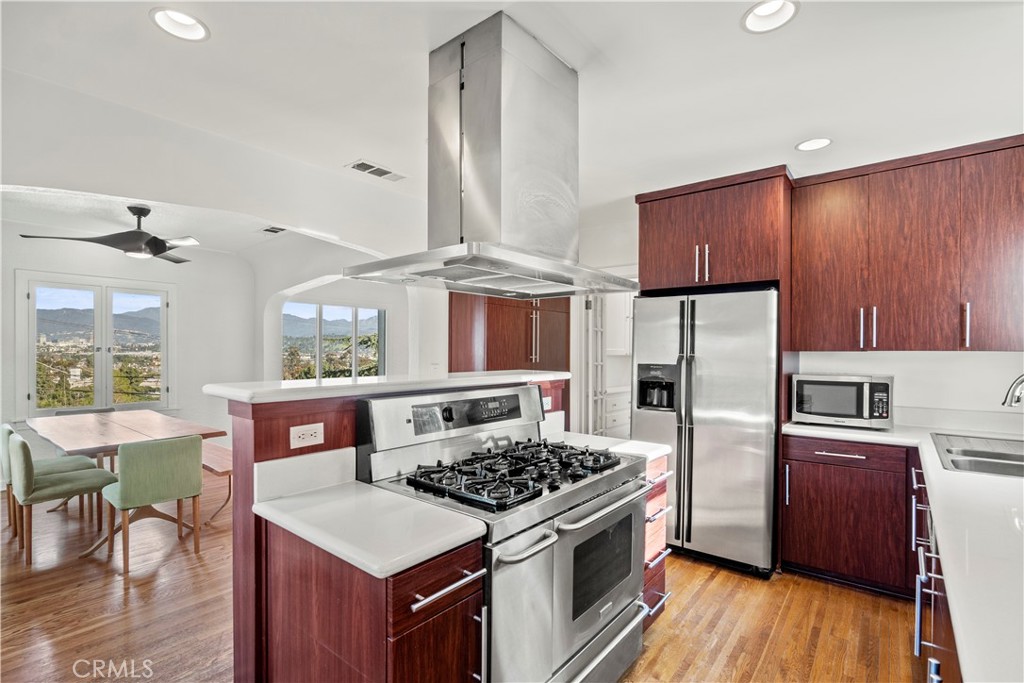 2559 Corralitas Drive Silver Lake, CA 90039 - Photo 22 of 54 a kitchen with a stove a refrigerator and wooden floor