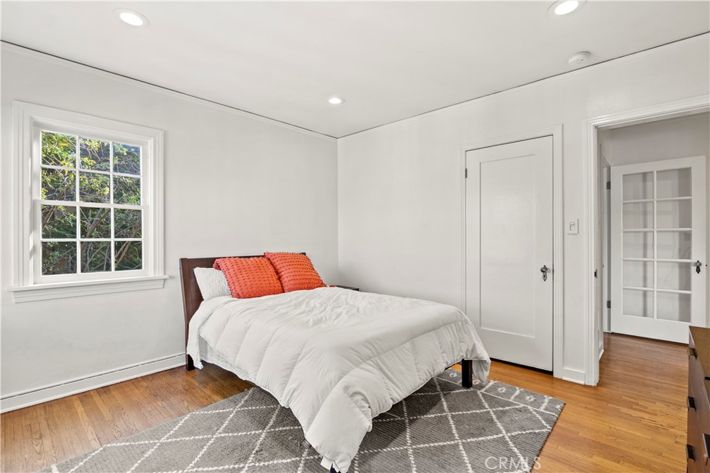 2559 Corralitas Drive Silver Lake, CA 90039 - Photo 26 of 54 a bedroom with a bed and a window