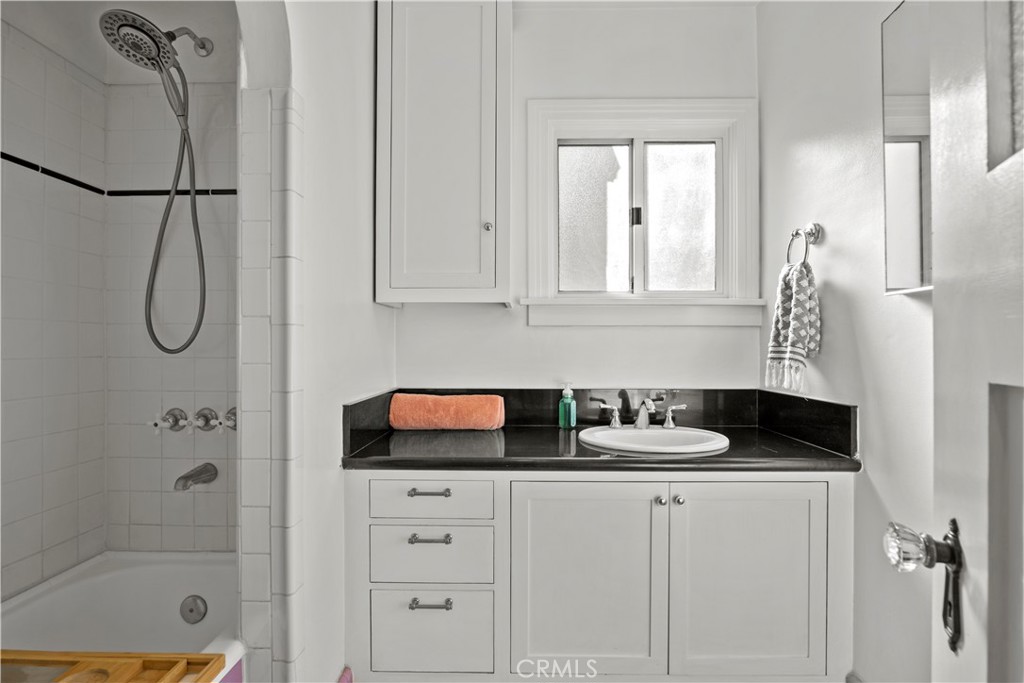 2559 Corralitas Drive Silver Lake, CA 90039 - Photo 29 of 54 a bathroom with a sink and a shower
