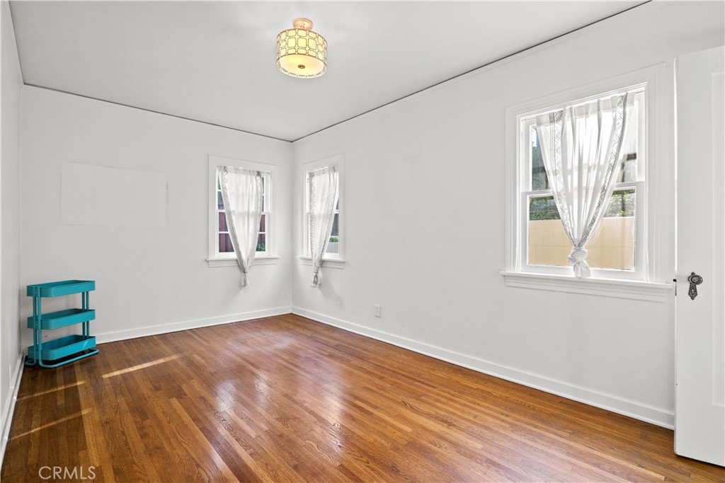 2559 Corralitas Drive Silver Lake, CA 90039 - Photo 31 of 54 a view of empty room with wooden floor and fan