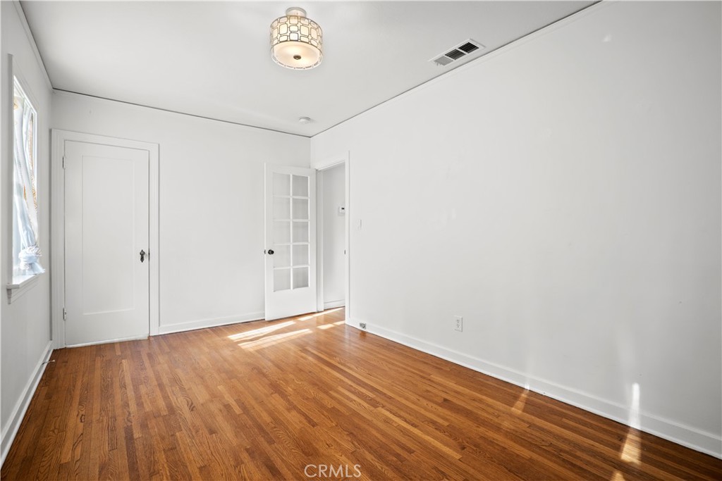 2559 Corralitas Drive Silver Lake, CA 90039 - Photo 32 of 54 a view of an empty room with wooden floor