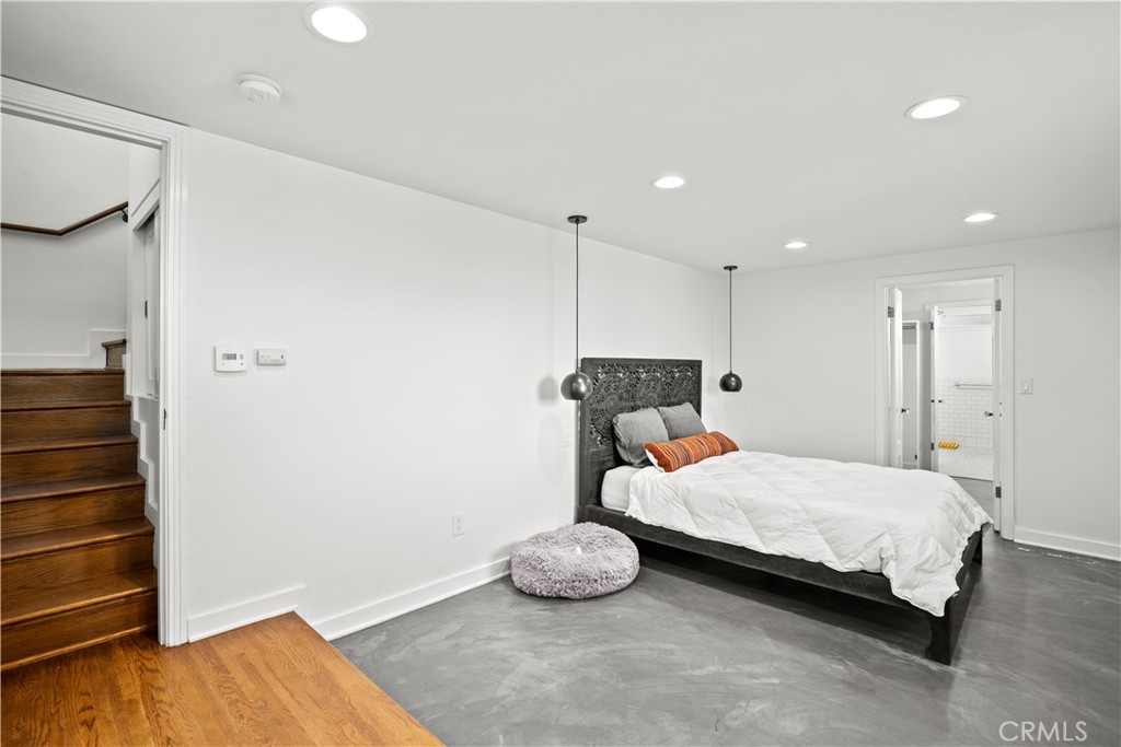 2559 Corralitas Drive Silver Lake, CA 90039 - Photo 35 of 54 a bedroom with a bed and a walk in closet