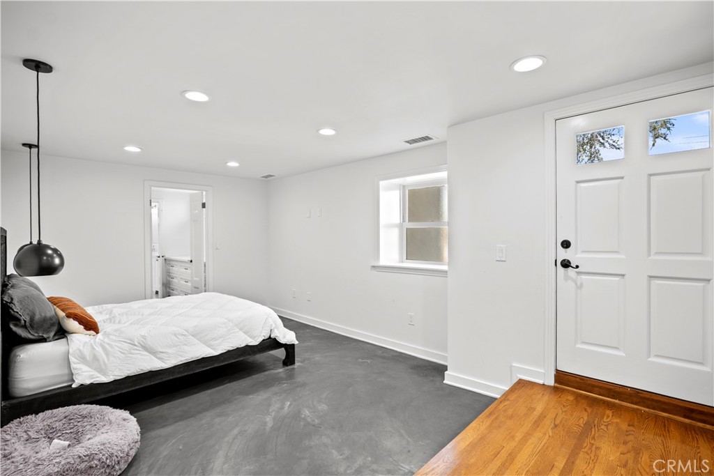 2559 Corralitas Drive Silver Lake, CA 90039 - Photo 38 of 54 a bedroom with a bed and a window