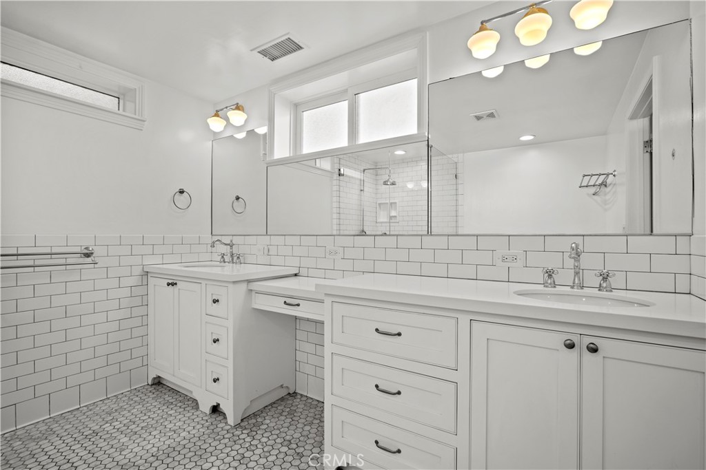 2559 Corralitas Drive Silver Lake, CA 90039 - Photo 43 of 54 a bathroom with a double vanity sink mirror and double
