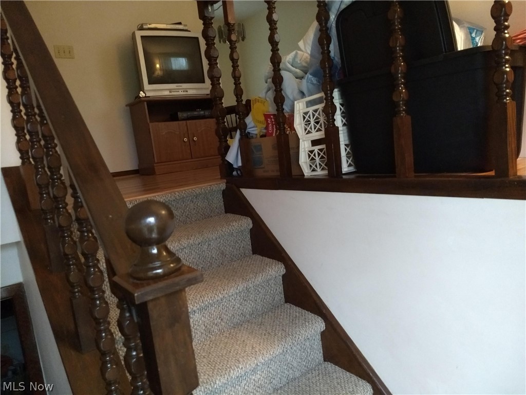 8168 Vermilion Road Amherst, OH 44001 - Photo 12 of 25 stairway up to living quarter and down to basement