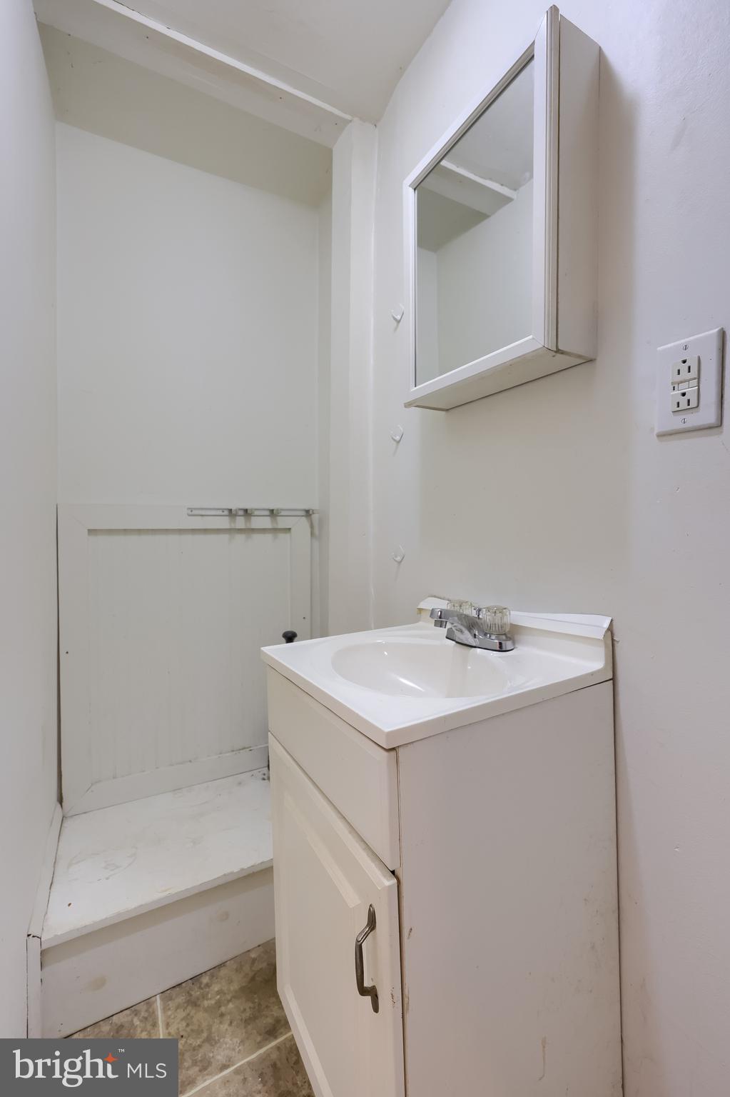 238 South 4th Street Columbia, PA 17512 - Photo 7 of 16 a bathroom with a sink and mirror