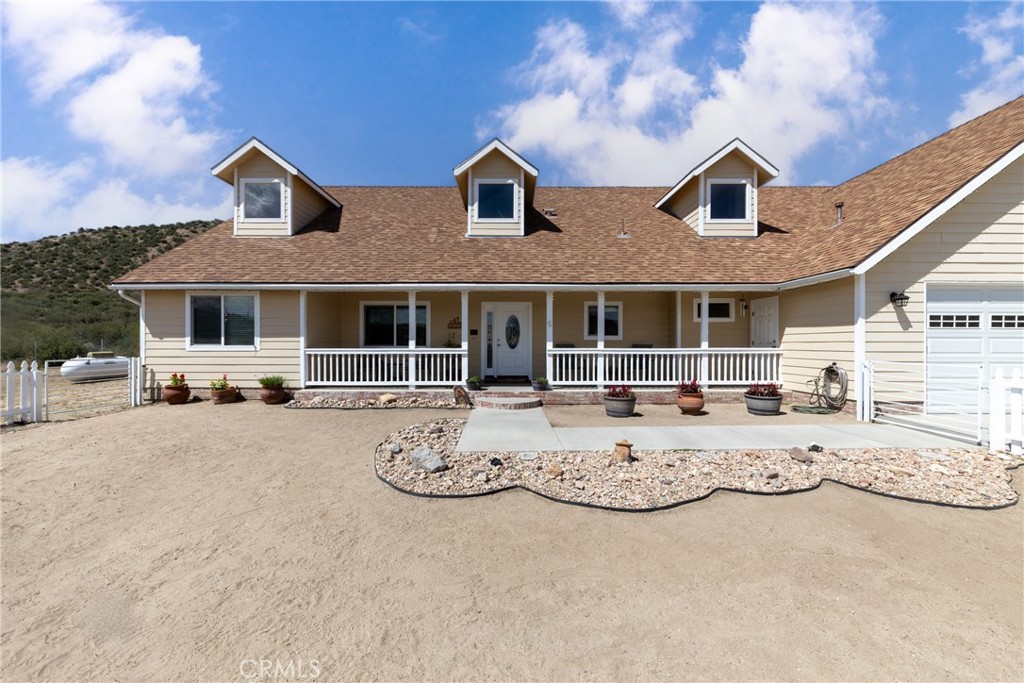 a view of a white house with large windows
