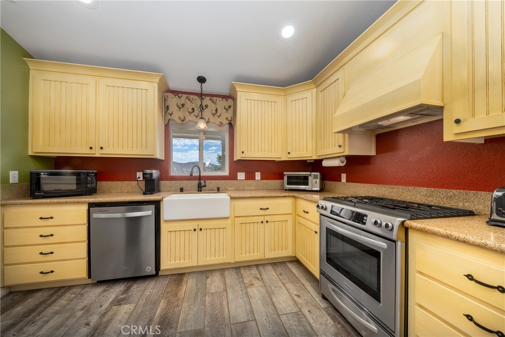 5935 Monte Vista Road Phelan, CA 92371 - Photo 17 of 58 a kitchen with a stove oven and sink