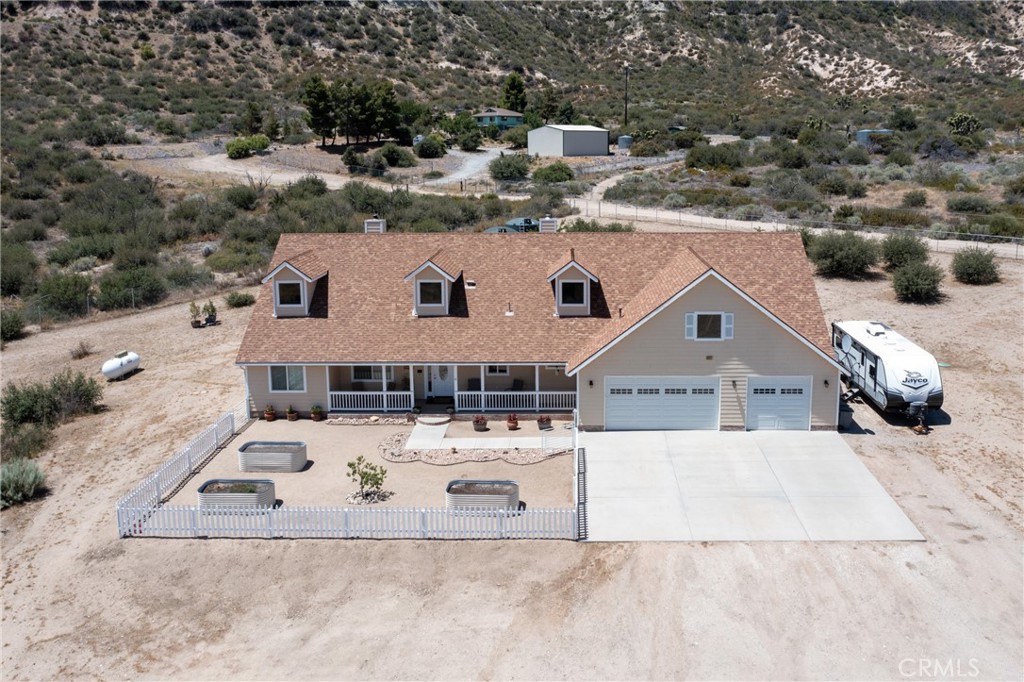 5935 Monte Vista Road Phelan, CA 92371 - Photo 2 of 58 an aerial view of a house with a yard covered with green space