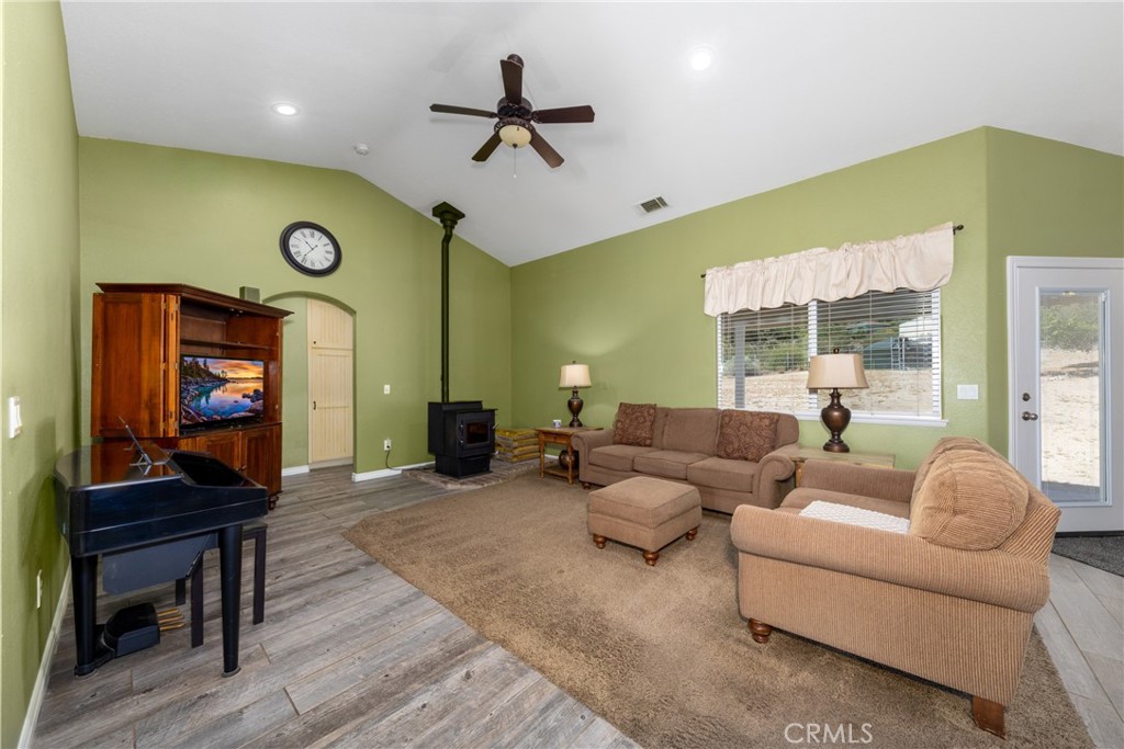 5935 Monte Vista Road Phelan, CA 92371 - Photo 21 of 58 a living room with furniture and a flat screen tv