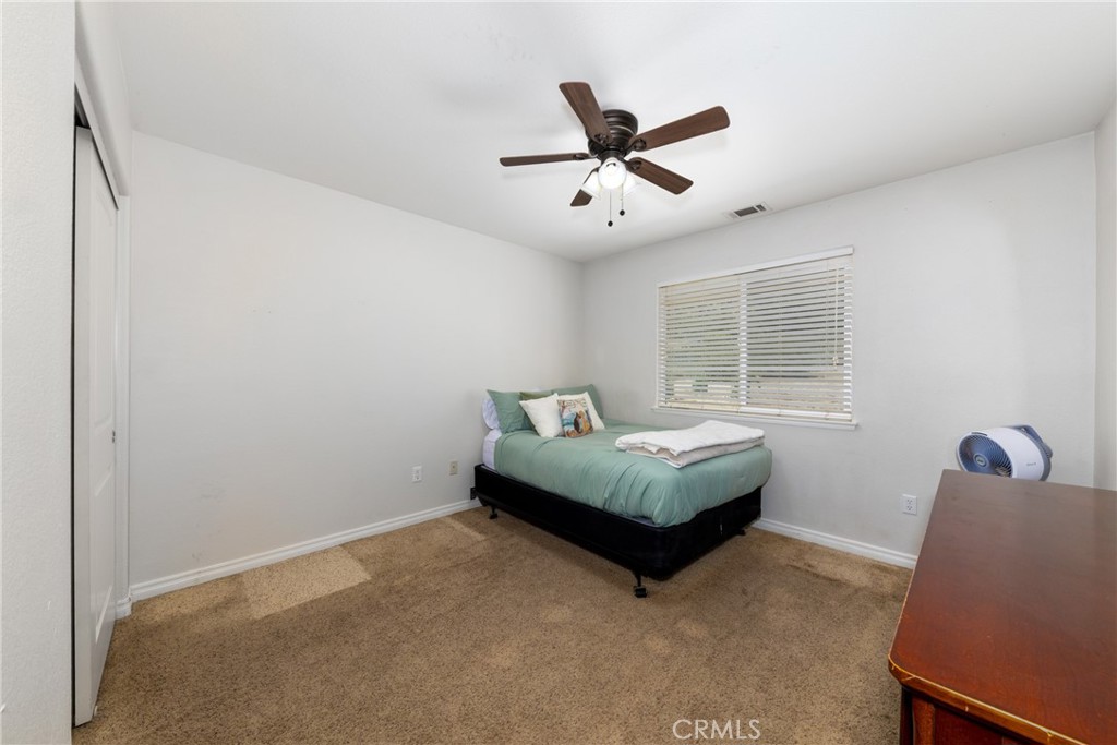 5935 Monte Vista Road Phelan, CA 92371 - Photo 35 of 58 a living room with furniture and a window
