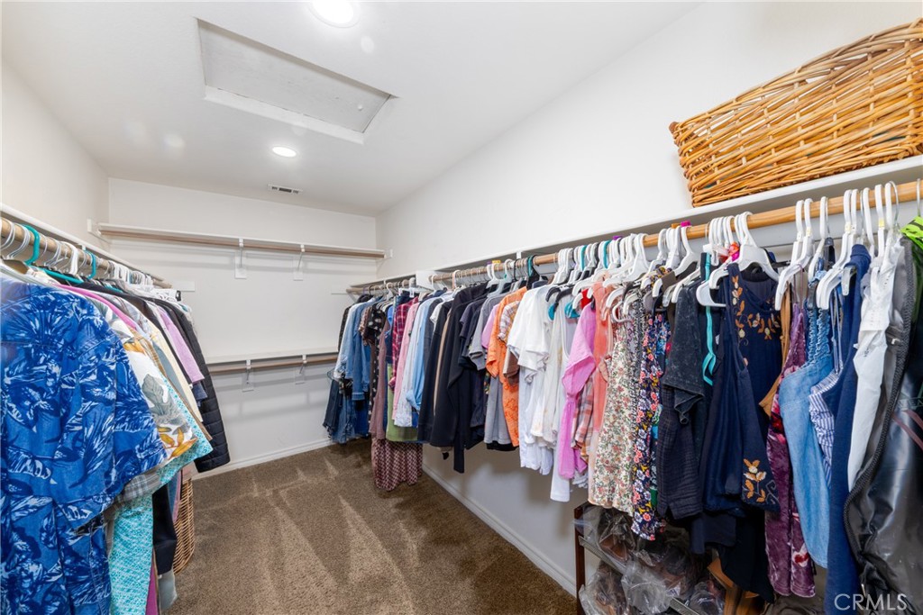 5935 Monte Vista Road Phelan, CA 92371 - Photo 41 of 58 a view of walk in closet with clothes